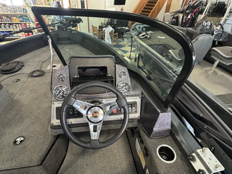Slide: The Image of 2023 Ranger VS1782 Angler boat dashboard with steering wheel and gauges. - 17