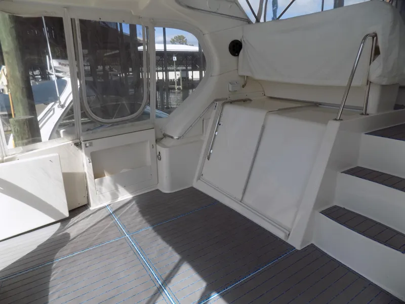 Slide: The Image of 2005 Silverton 43 Motor Yacht interior with stairs and seating area. - 14