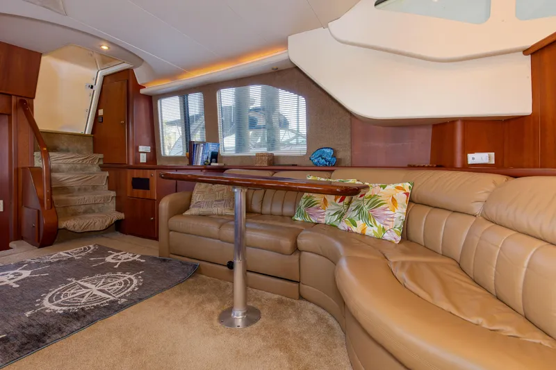 Slide: The Image of Luxurious interior of 2005 Silverton 43 Motor Yacht with plush seating and elegant decor. - 18
