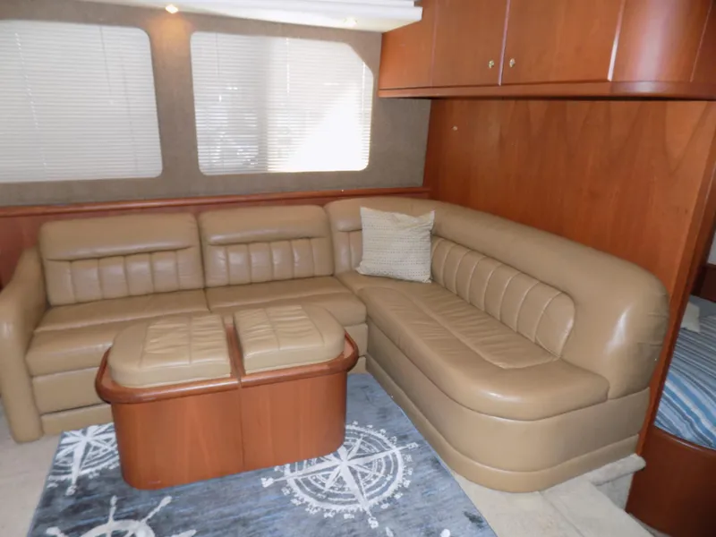 Slide: The Image of Luxurious interior of 2005 Silverton 43 Motor Yacht with leather seating and nautical decor. - 21