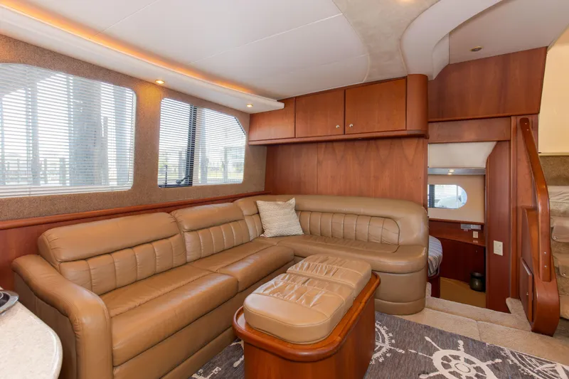Slide: The Image of Luxurious interior of 2005 Silverton 43 Motor Yacht with leather seating and wood accents. - 22