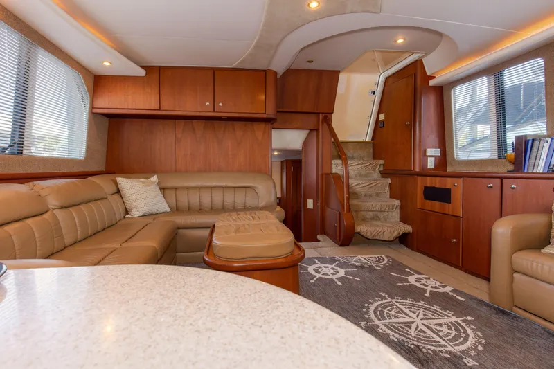 Slide: The Image of Interior of 2005 Silverton 43 Motor Yacht with luxurious seating and nautical decor. - 24