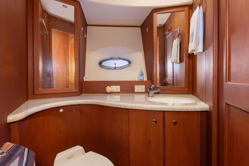 Slide: The Image of Luxurious bathroom in 2005 Silverton 43 Motor Yacht with wooden cabinetry and modern fixtures. - 29