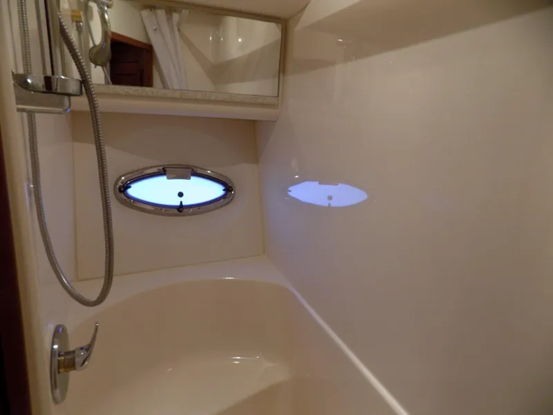 Slide: The Image of 2005 Silverton 43 Motor Yacht bathroom with shower and porthole window. - 37