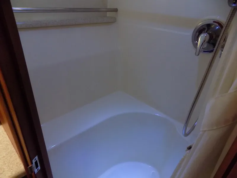 Slide: The Image of Shower area in 2005 Silverton 43 Motor Yacht, featuring sleek fixtures and a clean design. - 40