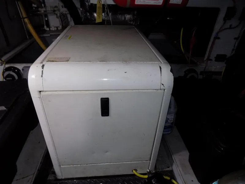 Slide: The Image of 2005 Silverton 43 Motor Yacht engine room with equipment and storage cabinet. - 41