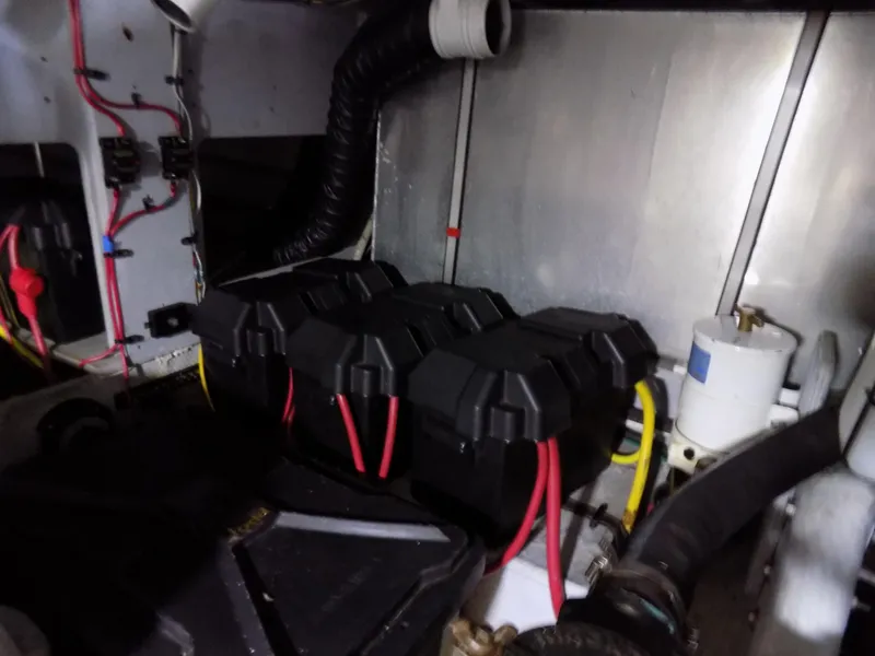 Slide: The Image of Engine room of 2005 Silverton 43 Motor Yacht with battery setup and wiring. - 42