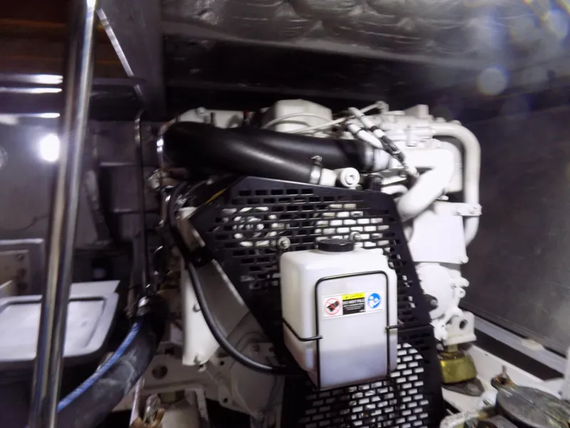 Slide: The Image of Engine room of a 2005 Silverton 43 Motor Yacht, showcasing mechanical components. - 44