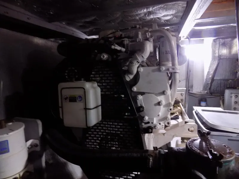 Slide: The Image of Engine room of a 2005 Silverton 43 Motor Yacht, showcasing mechanical components. - 45