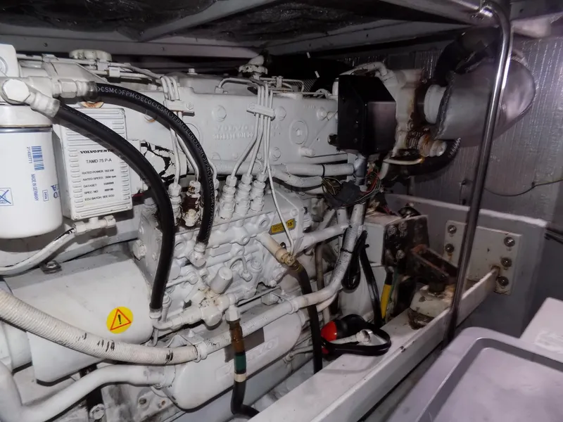 Slide: The Image of Engine room of a 2005 Silverton 43 Motor Yacht, showcasing mechanical components. - 46