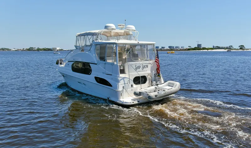 Slide: The Image of 2005 Silverton 43 Motor Yacht cruising on a sunny day, rear view. - 49