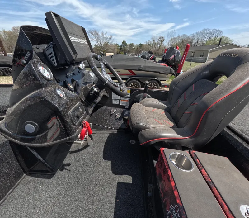 Slide: The Image of Interior of a 2019 Nitro Z19 boat with steering wheel and seat. - 13