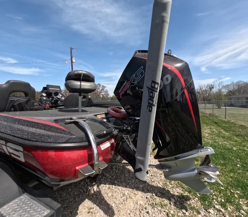 Slide: The Image of 2019 Nitro Z19 boat with powerful outboard motor and sleek design, parked outdoors. - 19