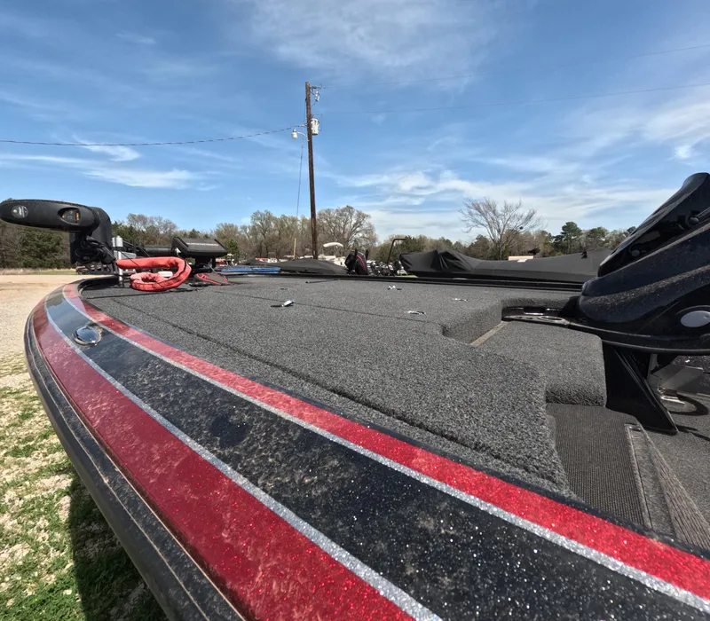 Slide: The Image of 2019 Nitro Z19 boat deck with red trim under clear blue sky. - 7