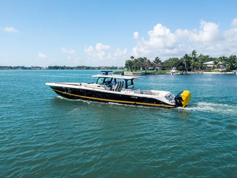 Slide: The Image of 2020 HCB 53 Sueños boat cruising on a sunny day in a tropical setting. - 13