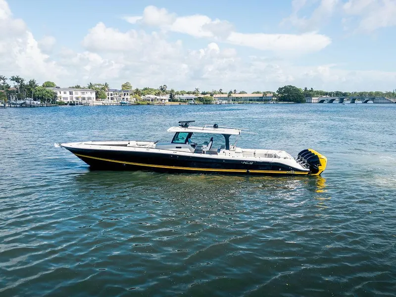 Slide: The Image of 2020 HCB 53 Sueños boat on calm water with scenic background. - 18