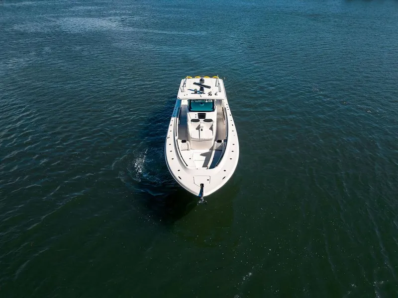 Slide: The Image of 2020 HCB 53 Sueños boat cruising on open water, aerial view. - 19