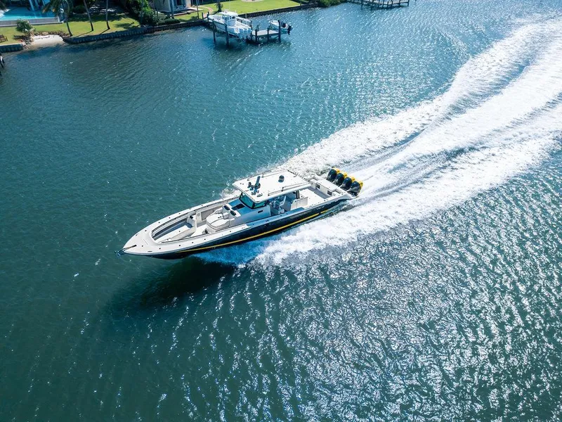 Slide: The Image of Aerial view of 2020 HCB 53 Sueños boat cruising on a sunny waterway. - 24
