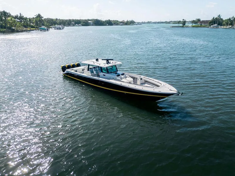 Slide: The Image of 2020 HCB 53 Sueños boat cruising on a sunny, tranquil waterway. - 25