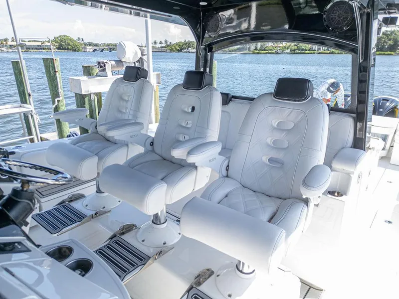 Slide: The Image of Luxury seating on 2020 HCB 53 Sueños boat, featuring plush white captain chairs. - 27
