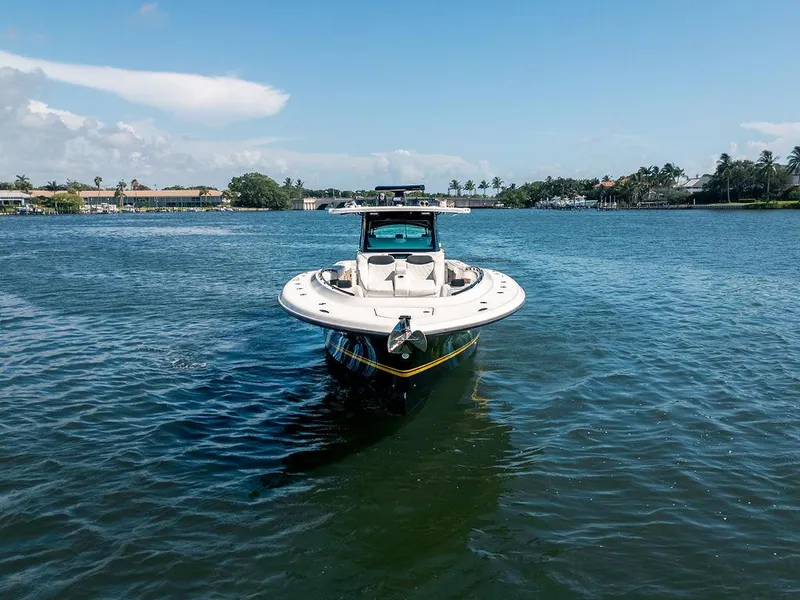 Slide: The Image of 2020 HCB 53 Sueños boat on calm water under clear blue sky. - 29