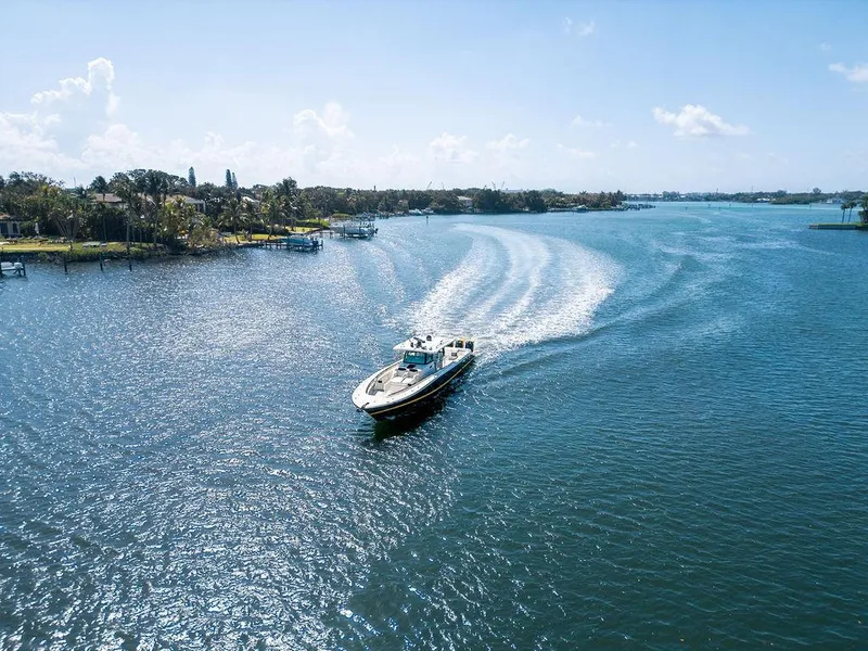 Slide: The Image of Aerial view of 2020 HCB 53 Sueños boat cruising on a sunny, scenic waterway. - 32