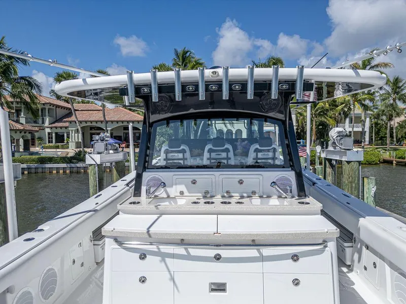 Slide: The Image of 2020 HCB 53 Sueños boat docked, featuring spacious deck and modern design. - 34