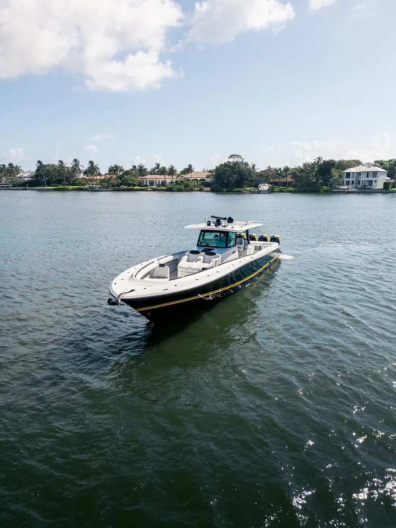Slide: The Image of 2020 HCB 53 Sueños boat cruising on a sunny day in a calm waterway. - 35