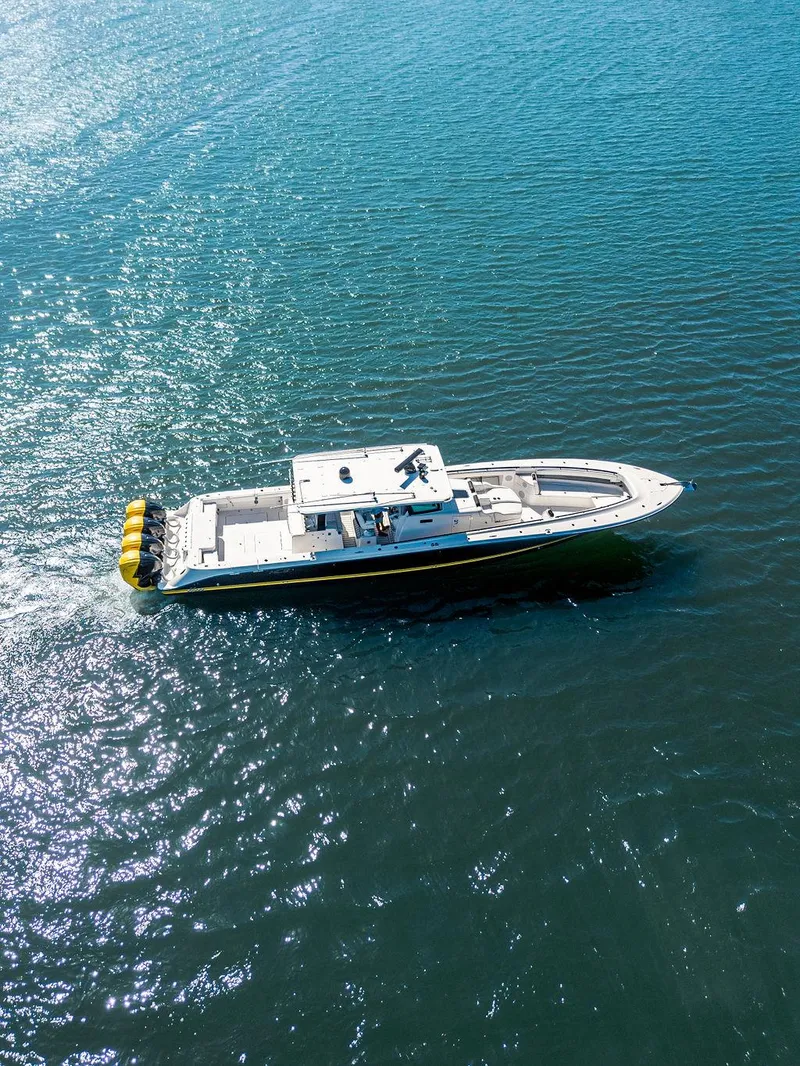 Slide: The Image of Aerial view of 2020 HCB 53 Sueños boat cruising on clear blue water. - 36