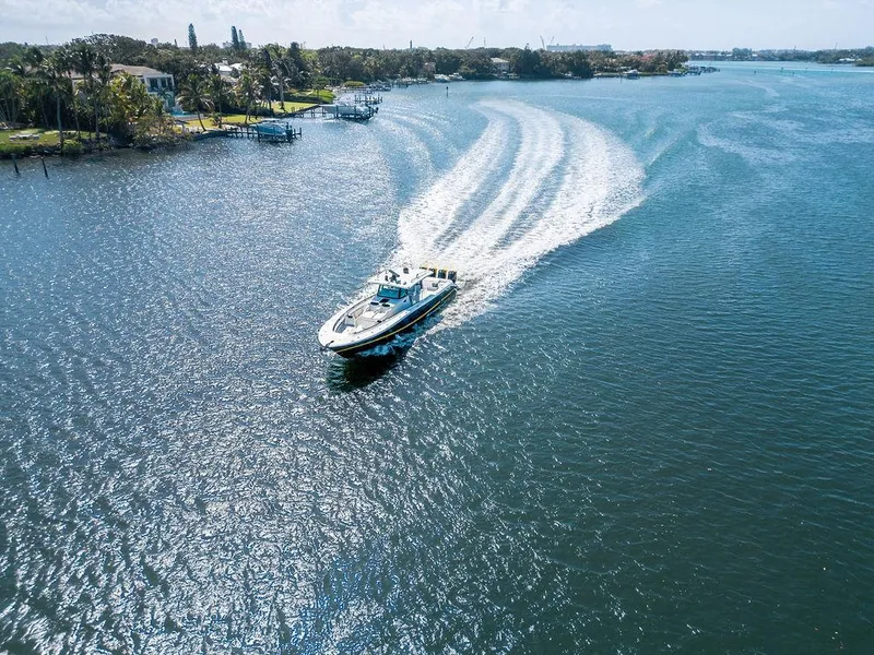 Slide: The Image of Aerial view of 2020 HCB 53 Sueños boat cruising on a sunny waterway. - 7