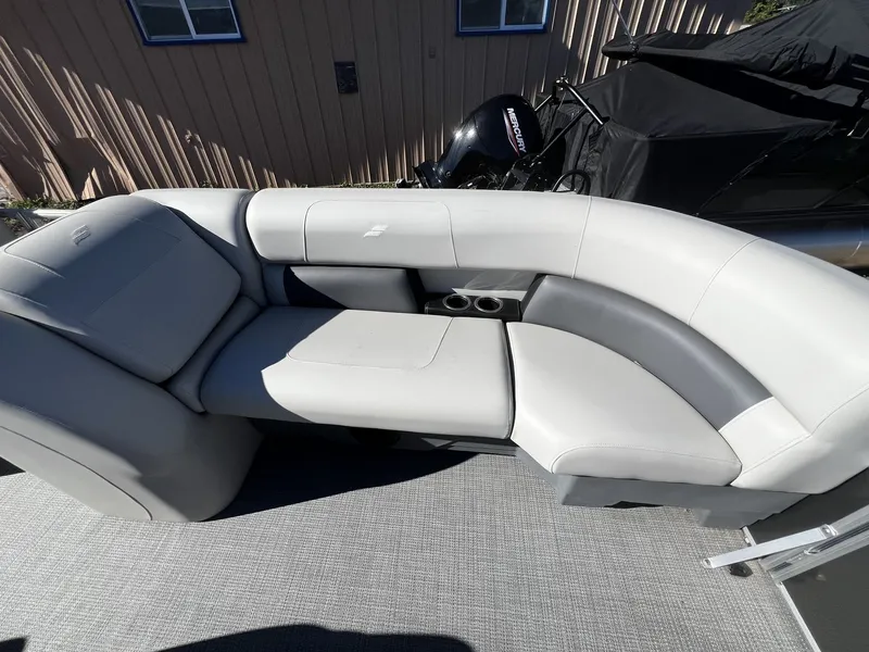 Slide: The Image of The image shows an elegant, gray seating area on a boat, with an engine in the background. - 7