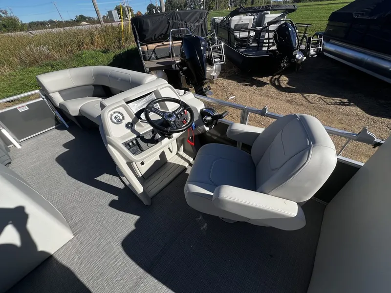 Slide: The Image of Starcraft LX 22 R 2025: Spacious deck with comfortable seating and modern helm station. - 3