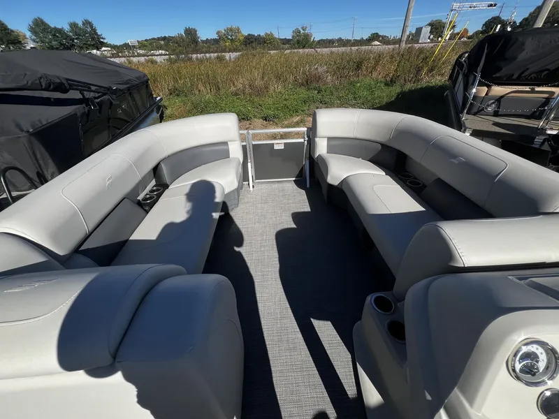 Slide: The Image of The image shows the interior of a 2025 Starcraft LX 22 R boat with gray seating. - 5