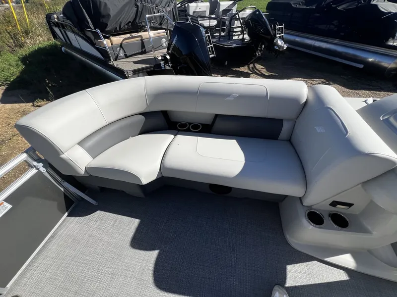 Slide: The Image of The image shows the seating area of a 2025 Starcraft LX 22 R with gray upholstery. - 6