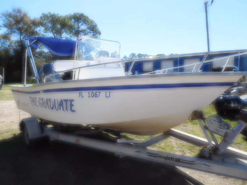 The Image of 2001 Cape Horn 17 CC boat on trailer, named "The Graduate," with blue accents. - 1