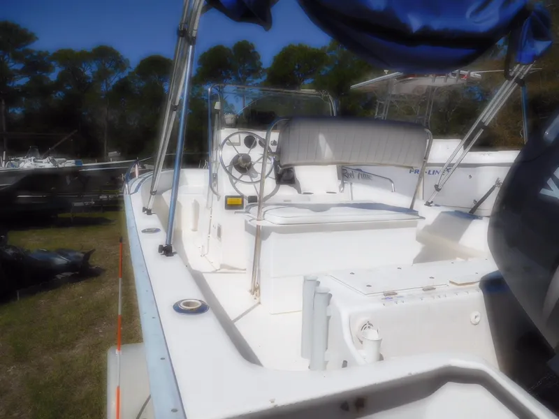 Slide: The Image of 2001 Cape Horn 17 CC boat with center console, parked outdoors. - 3