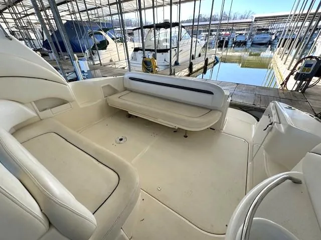 Slide: The Image of 2005 Sea Ray 360 Sundancer boat interior with seating, docked in marina. - 13