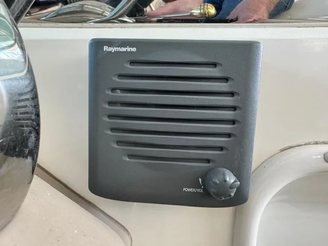 Slide: The Image of Raymarine speaker on 2005 Sea Ray 360 Sundancer boat dashboard. - 23