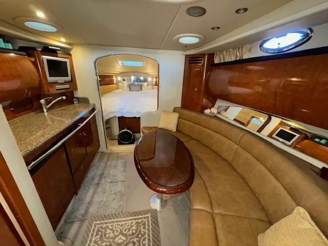 Slide: The Image of Luxurious interior of 2005 Sea Ray 360 Sundancer yacht with kitchen and seating area. - 24