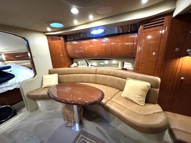 Slide: The Image of Luxurious interior of 2005 Sea Ray 360 Sundancer yacht with leather seating and wooden cabinetry. - 25
