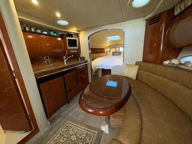 Slide: The Image of Interior of 2005 Sea Ray 360 Sundancer yacht with kitchen and seating area. - 27
