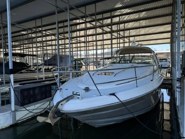 Slide: The Image of 2005 Sea Ray 360 Sundancer docked in a covered marina. - 3
