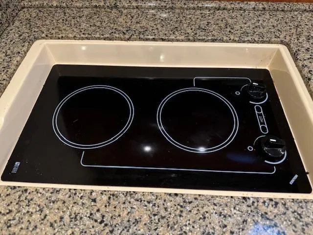 Slide: The Image of Built-in stovetop on 2005 Sea Ray 360 Sundancer, set in granite countertop. - 32