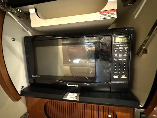 Slide: The Image of Panasonic microwave inside a 2005 Sea Ray 360 Sundancer yacht kitchen. - 34