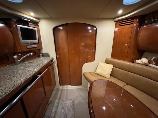 Slide: The Image of Luxurious interior of 2005 Sea Ray 360 Sundancer yacht with wood finish and modern amenities. - 36