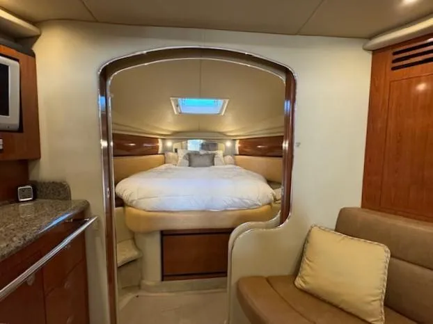 Slide: The Image of Interior of 2005 Sea Ray 360 Sundancer yacht with cozy bedroom and elegant furnishings. - 38