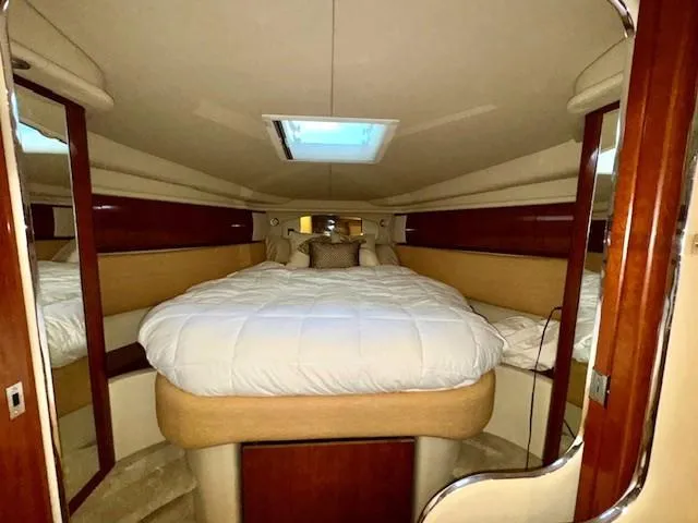 Slide: The Image of Luxurious cabin interior of 2005 Sea Ray 360 Sundancer yacht with plush bedding. - 39