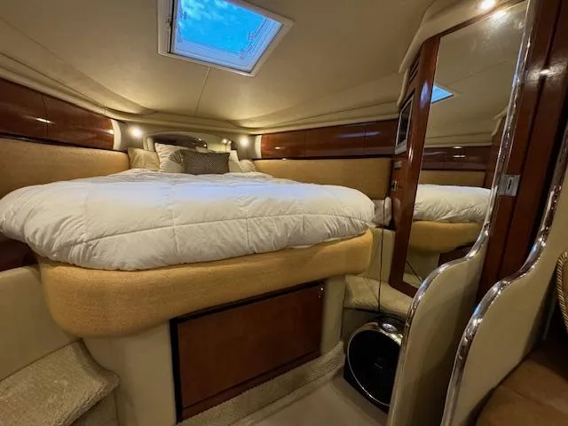 Slide: The Image of Luxurious cabin interior of 2005 Sea Ray 360 Sundancer yacht with plush bedding. - 40