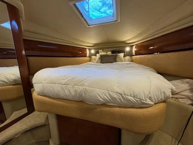 Slide: The Image of Luxurious cabin interior of 2005 Sea Ray 360 Sundancer with plush bedding and skylight. - 41