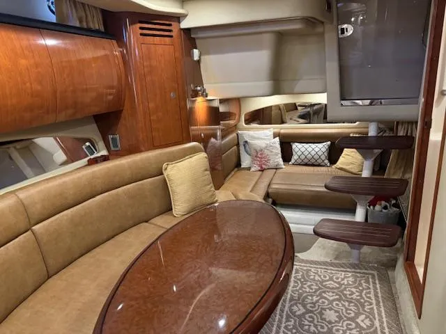 Slide: The Image of Luxurious interior of a 2005 Sea Ray 360 Sundancer yacht with elegant seating and wooden finishes. - 44